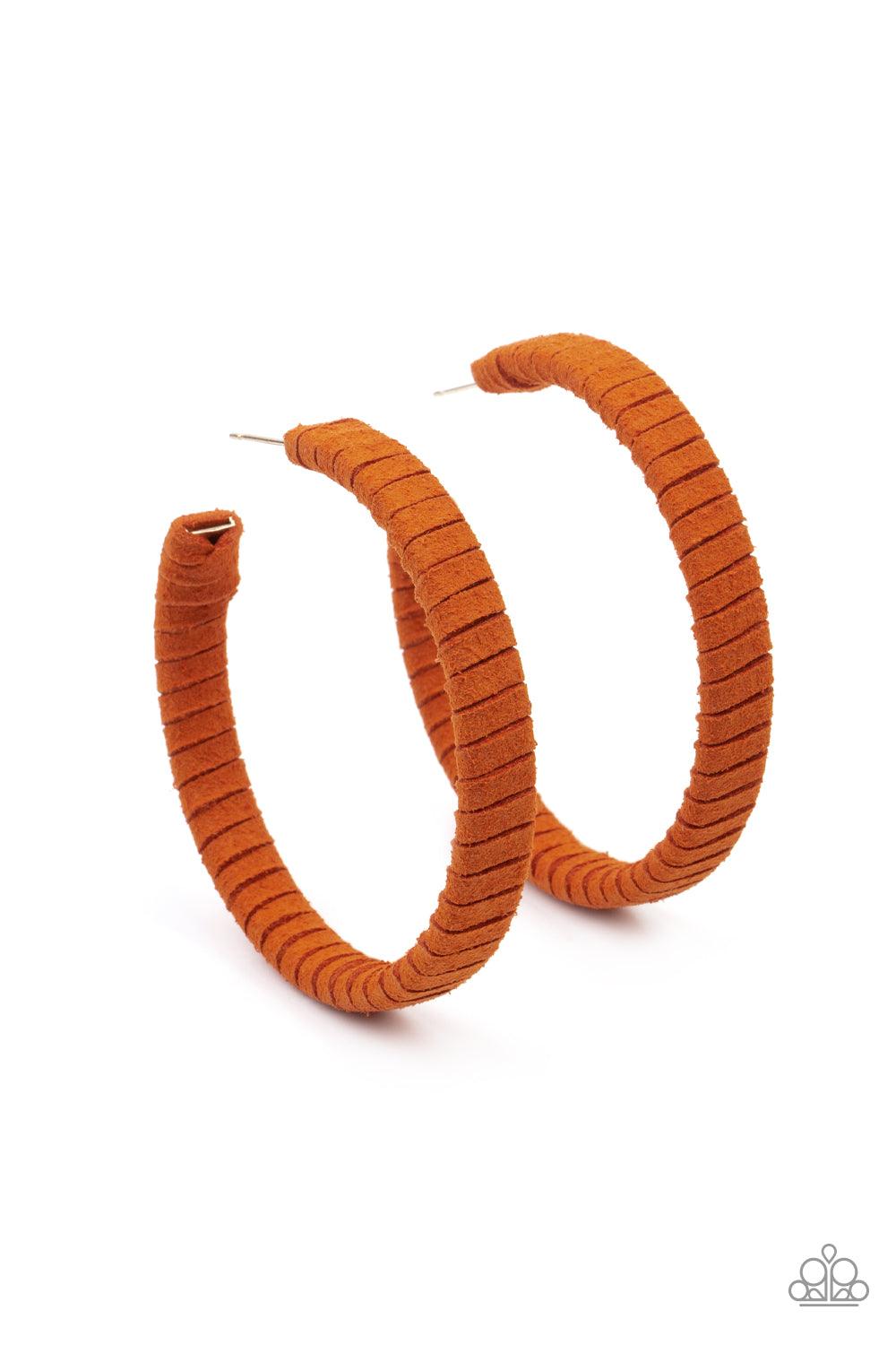 Paparazzi Accessories Suede Parade - Orange Orange suede cording wraps around an oversized hoop, creating an earthy pop of color. Earring attaches to a standard post fitting. Hoop measures approximately 2 1/4" in diameter. Sold as one pair of hoop earring