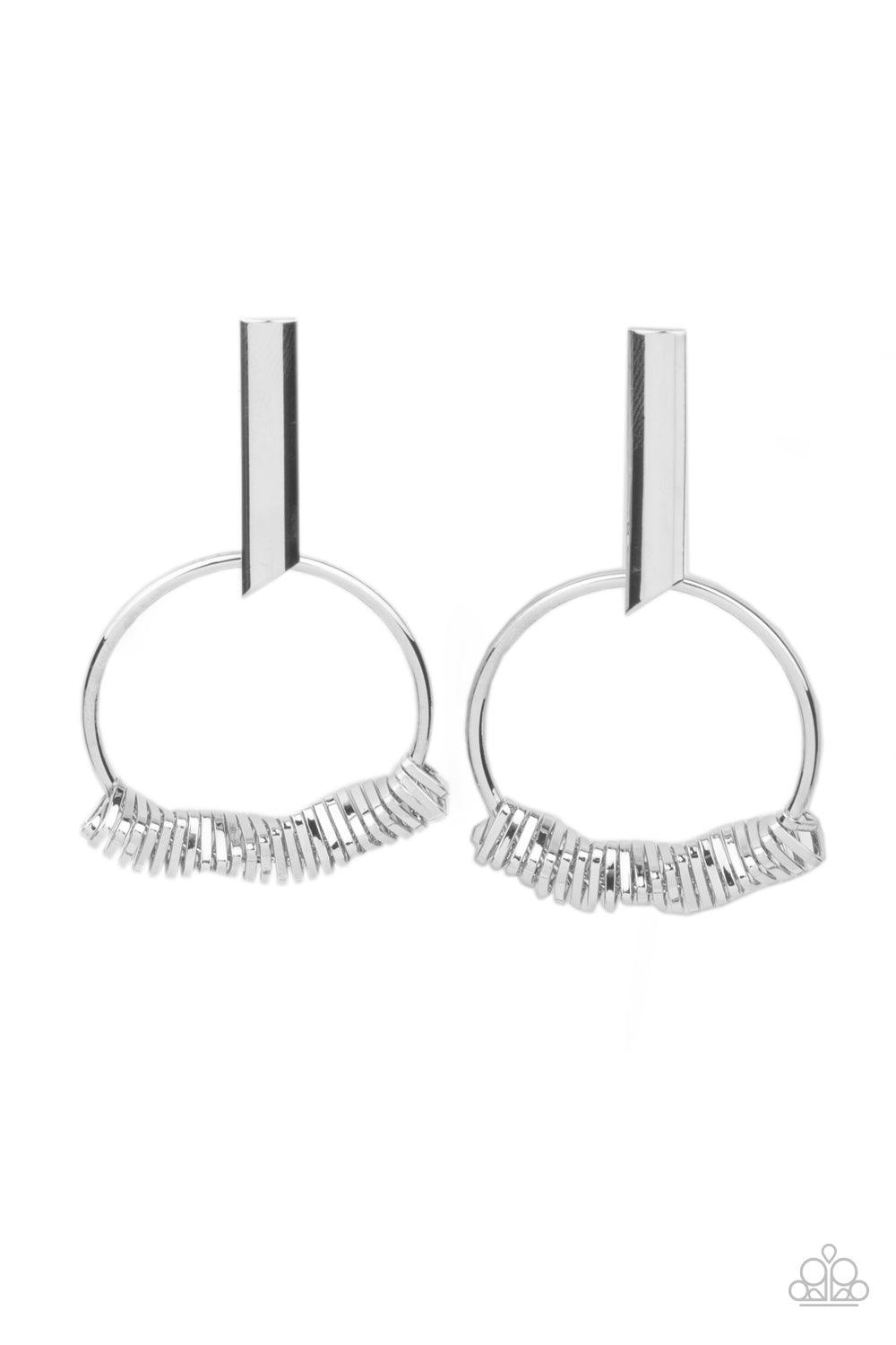 Paparazzi Accessories Set Into Motion - Silver Glistening silver triangular rings are delicately fitted in place along the bottom of a dainty silver hoop, creating the illusion of twisting movement. The edgy hoop links to a silver rectangular hoop, creati