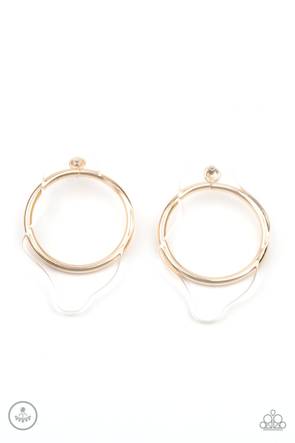 Paparazzi Accessories Clear The Way! - Gold An asymmetrical piece of clear acrylic overlaps a glistening gold hoop, creating a bold display. Earring attaches to a standard post fitting. Sold as one pair of post earrings. Jewelry