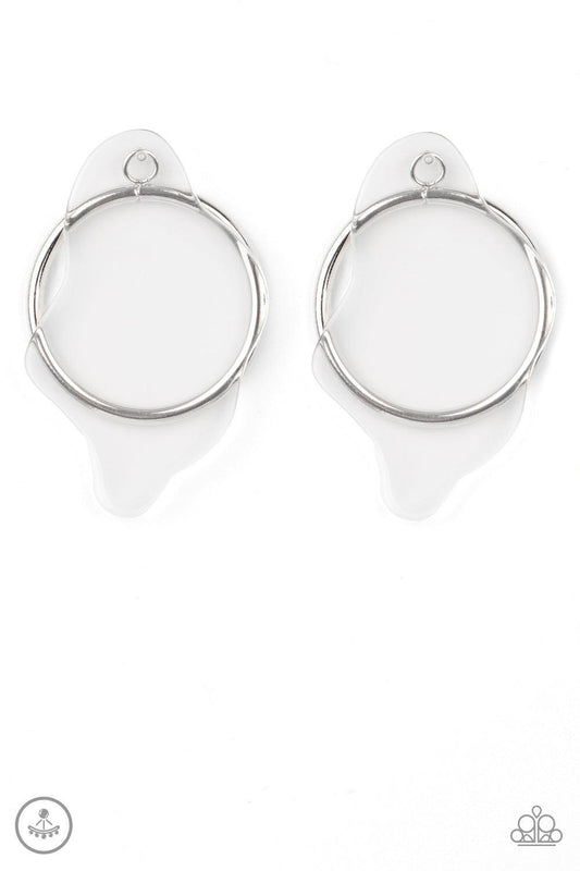 Paparazzi Accessories Clear The Way! - White A warped piece of clear acrylic attaches to a double-sided post, while an oversized silver hoop peeks out beneath the ear for a bold look. Earring attaches to a standard post fitting. Sold as one pair of double