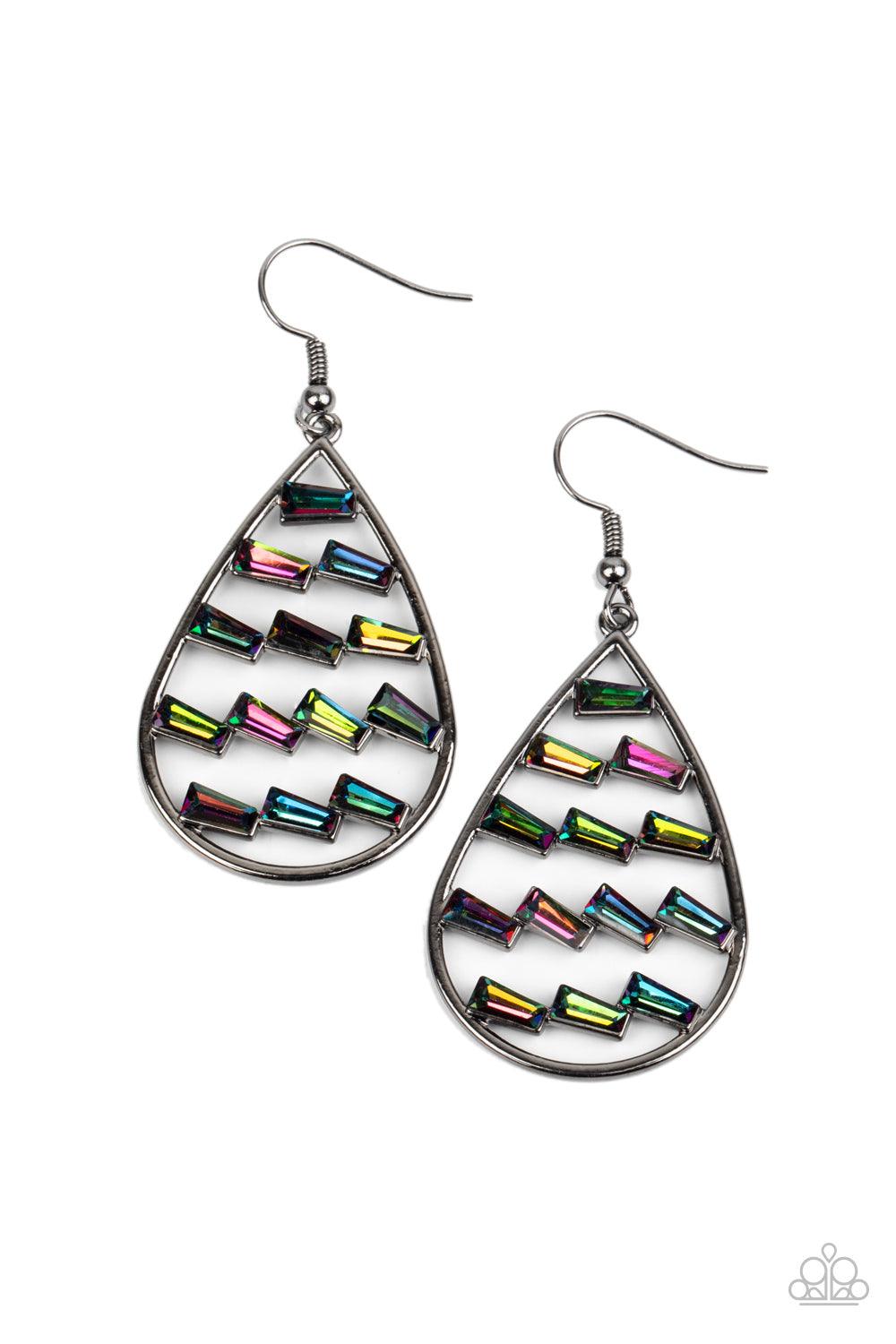 Paparazzi Accessories Glitzy Grit - Multi Flared emerald cut oil spill rhinestones haphazardly stack in rows across the center of an airy gunmetal teardrop, creating an edgy frame. Earring attaches to a standard fishhook fitting. Sold as one pair of earri
