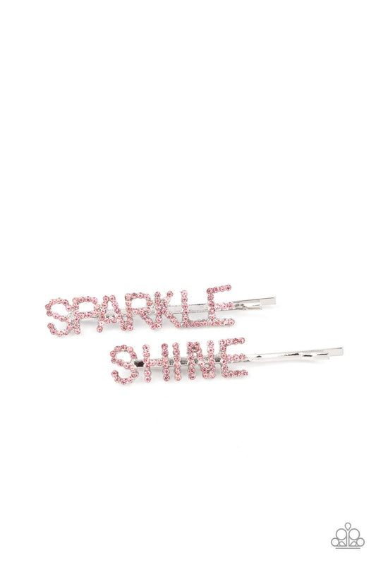 Paparazzi Accessories Center of the SPARKLE-verse - Pink Glassy pink rhinestones spell out "Sparkle," and "Shine," across the fronts of two silver bobby pins, creating a sparkly duo. Sold as one pair of decorative bobby pins. Hair Claws & Clips