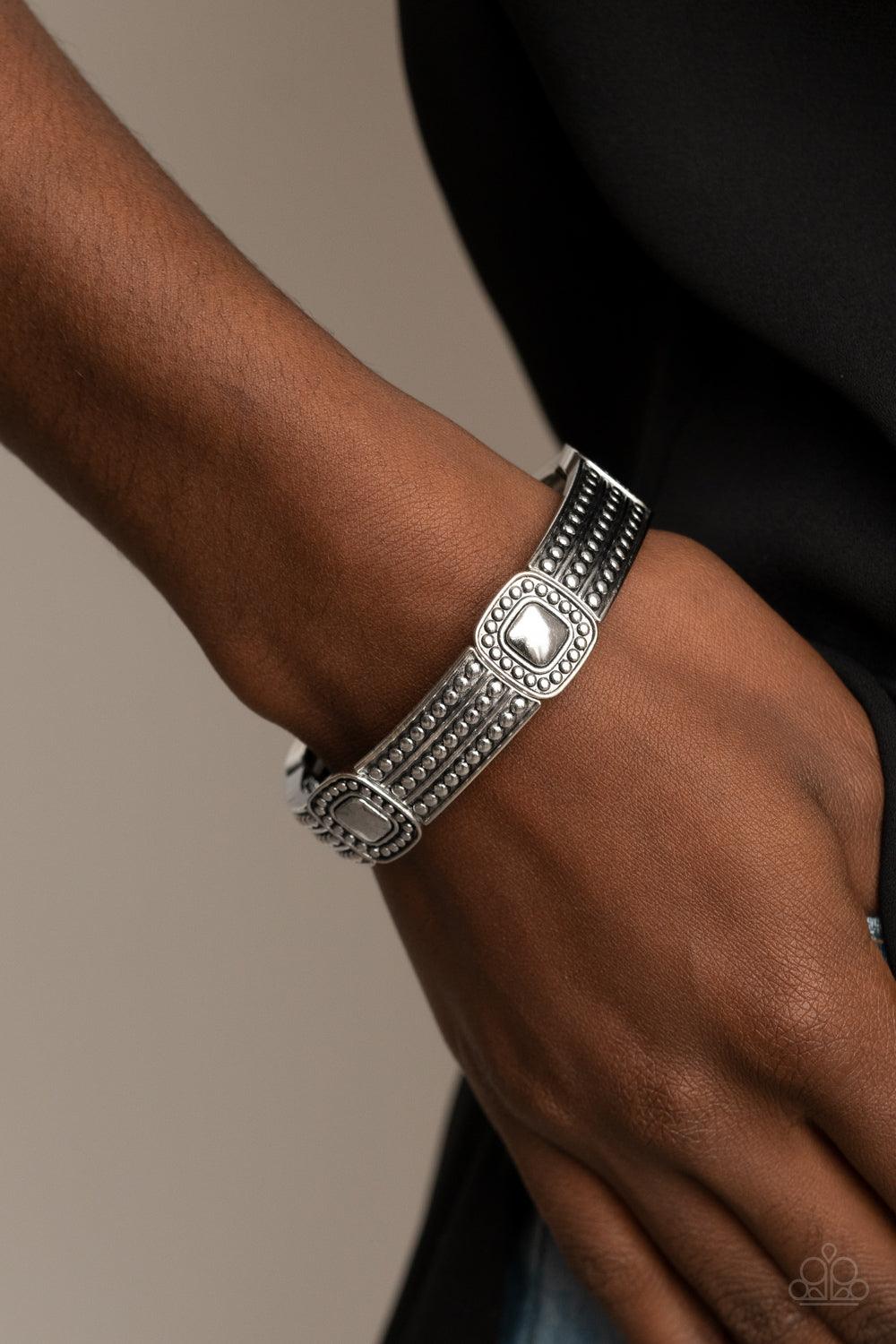 Paparazzi Accessories Rustic Redux - Silver Featuring silver studded patterns, square and rectangular frames are threaded along stretchy bands around the wrist for a rustic flair. Sold as one individual bracelet. Jewelry
