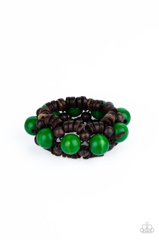 Paparazzi Accessories Tropical Temptations - Green Oversized green wooden beads, rustic brown wooden beads, and dainty wooden discs are ornately threaded along braided stretchy bands around the wrist, creating a summery centerpiece. Sold as one individual