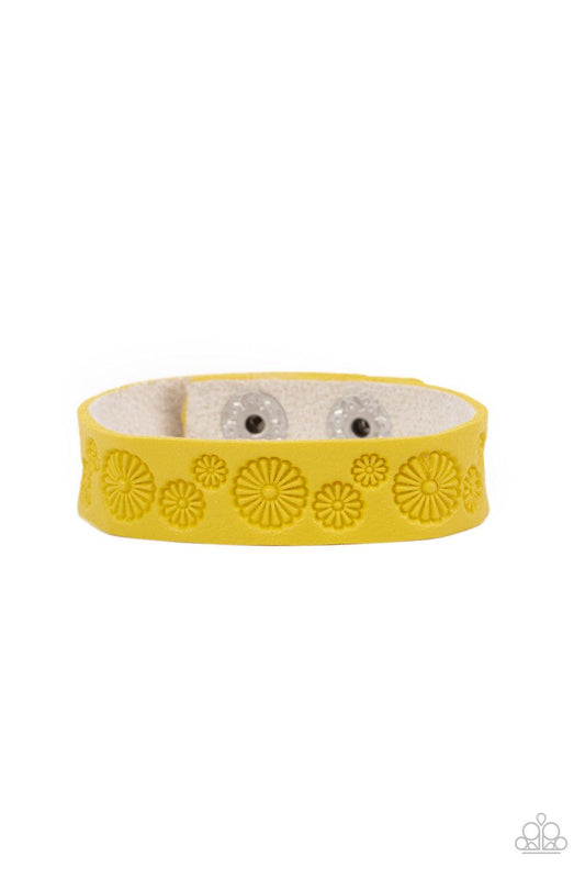 Paparazzi Accessories Follow The Wildflowers - Yellow Stamped in a whimsical daisy pattern, a dainty Illuminating leather band wraps around the wrist for a seasonal flair. Features an adjustable snap closure. Sold as one individual bracelet. Jewelry