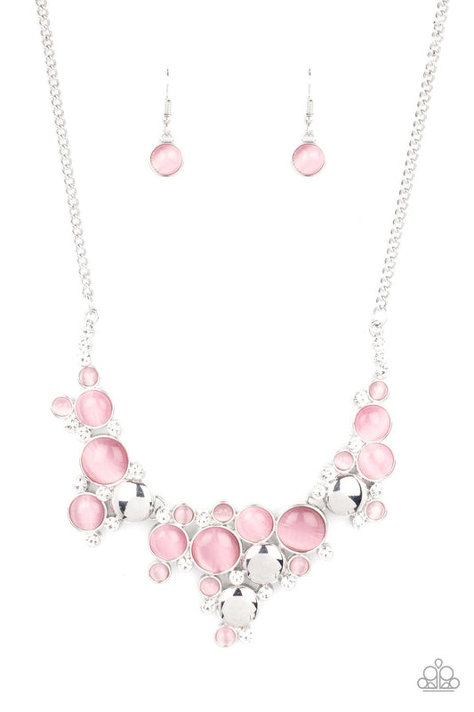 Paparazzi Accessories Fairytale Affair - Pink A bubbly collection of glowing pink cat's eye stones, glassy white rhinestones, and shiny silver discs delicately coalesces into enchanting frames below the collar that link into a whimsical centerpiece. Featu