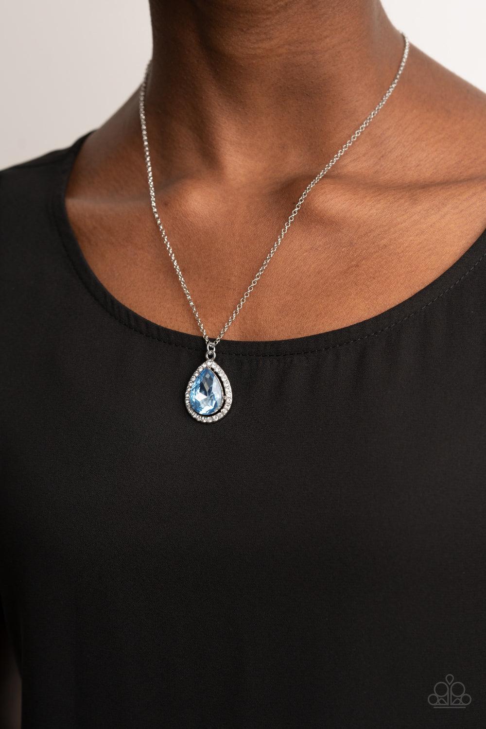 Paparazzi Accessories Duchess Decorum - Blue An oversized Cerulean rhinestone teardrop is pressed into the center of a silver frame bordered in white rhinestones, creating a glamorous pendant below the collar. Features an adjustable clasp closure. Sold as