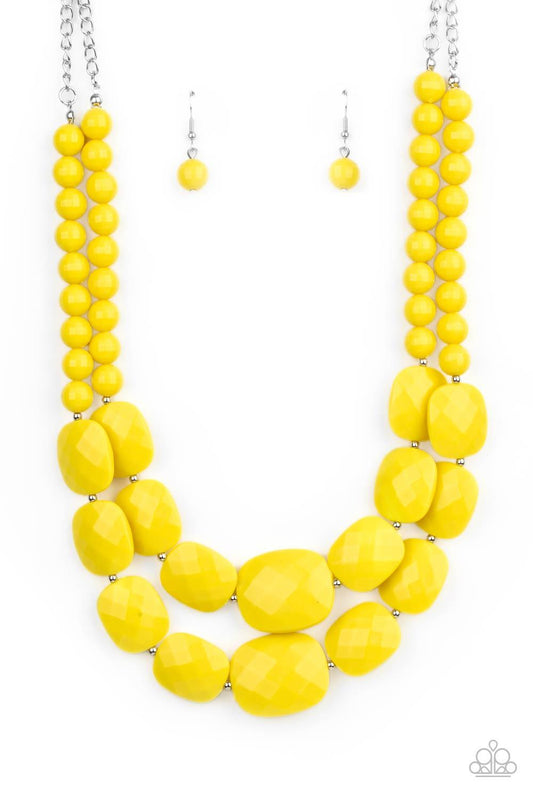 Paparazzi Accessories Resort Ready - Yellow Featuring square facets, strands of shimmery Illuminating beads give way to an oversized collection of flattened Illuminating beads. Featuring faceted surfaces, the asymmetrical beads catch and reflect the light