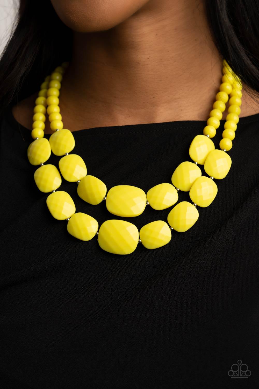 Paparazzi Accessories Resort Ready - Yellow Featuring square facets, strands of shimmery Illuminating beads give way to an oversized collection of flattened Illuminating beads. Featuring faceted surfaces, the asymmetrical beads catch and reflect the light