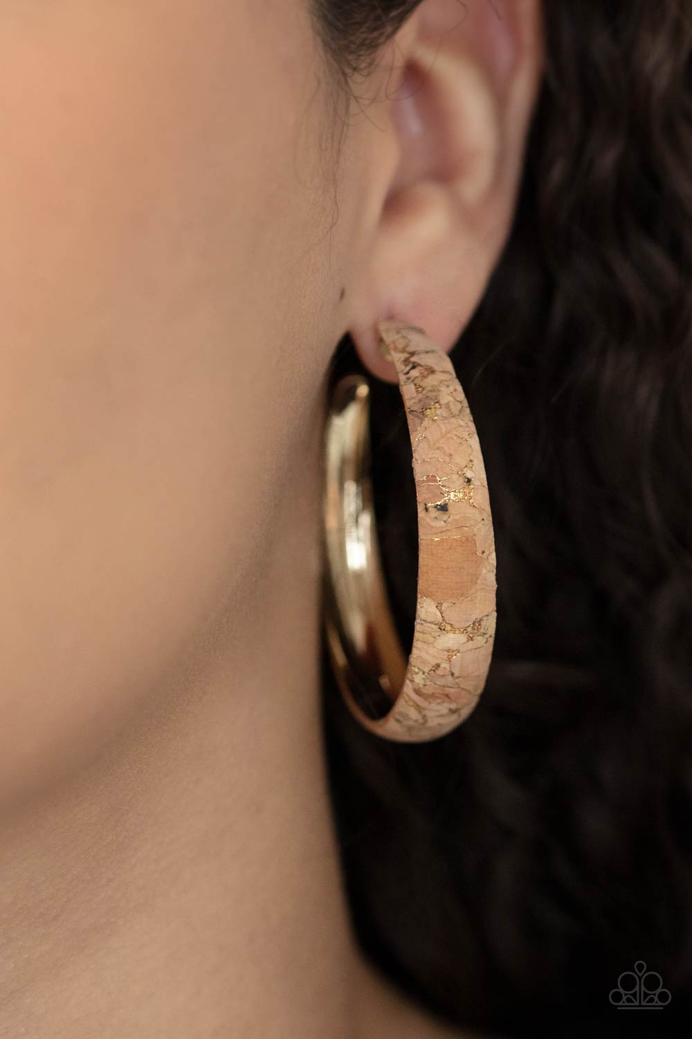 Paparazzi Accessories A CORK In The Road - Gold Golden veins accent the front of a cork lined gold hoop, creating a refined display. Hoop measures approximately 2" in diameter. Earring attaches to a standard post fitting. Sold as one pair of hoop earrings