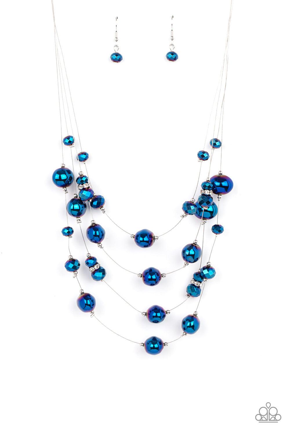 Paparazzi Accessories Cosmic Real Estate - Blue Featuring an oil spill finish, metallic blue beads and faceted crystal-like accents are fitted in place along dainty wires, creating the illusion of floating layers below the collar. Dainty silver beads and