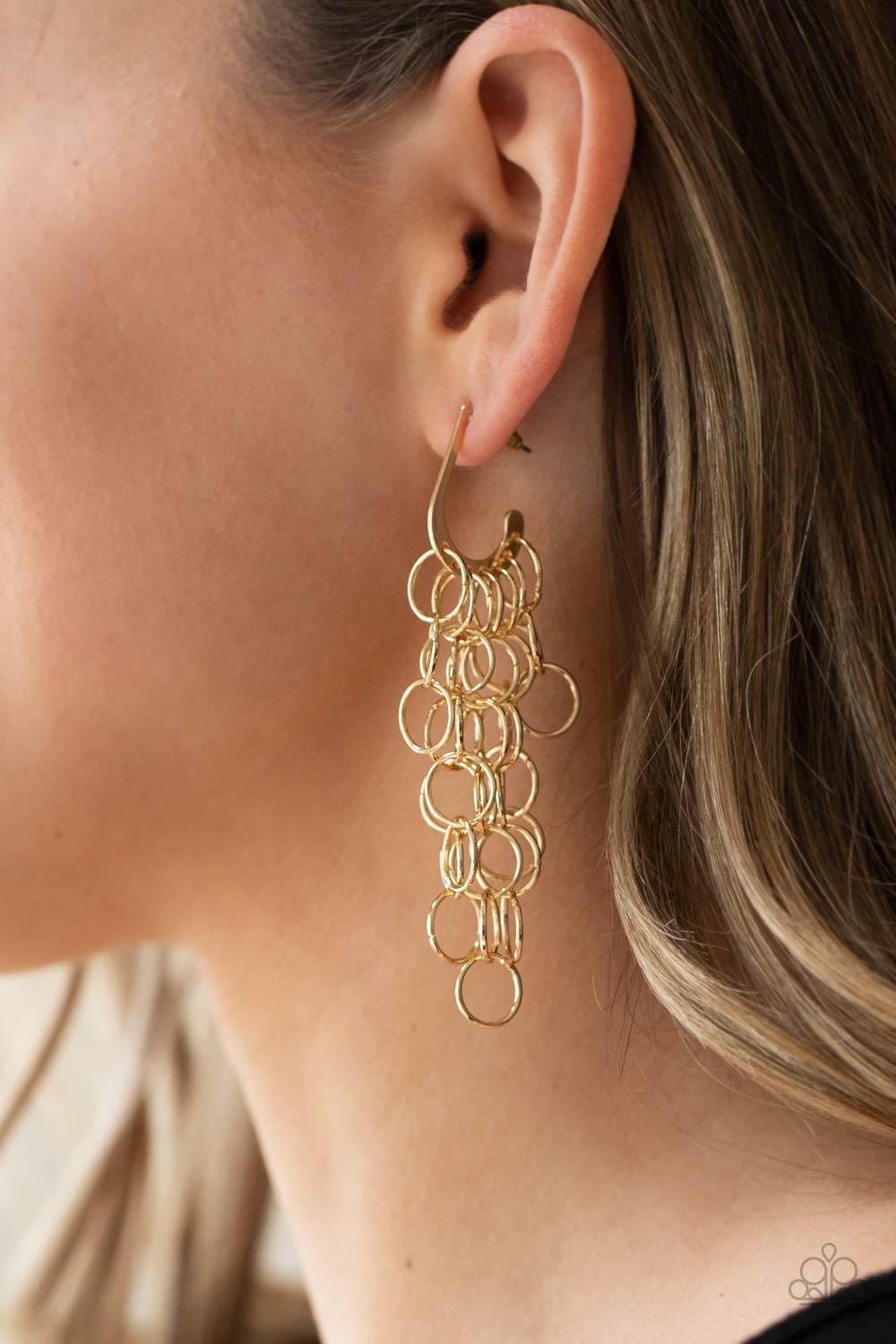 Paparazzi Accessories Long Live The Rebels - Gold Strands of shiny gold links cascade from the bottom of a dainty hook shaped hoop, creating a rebellious fringe. Hoop measures approximately 1/2" in diameter. Earring attaches to a standard post fitting. So