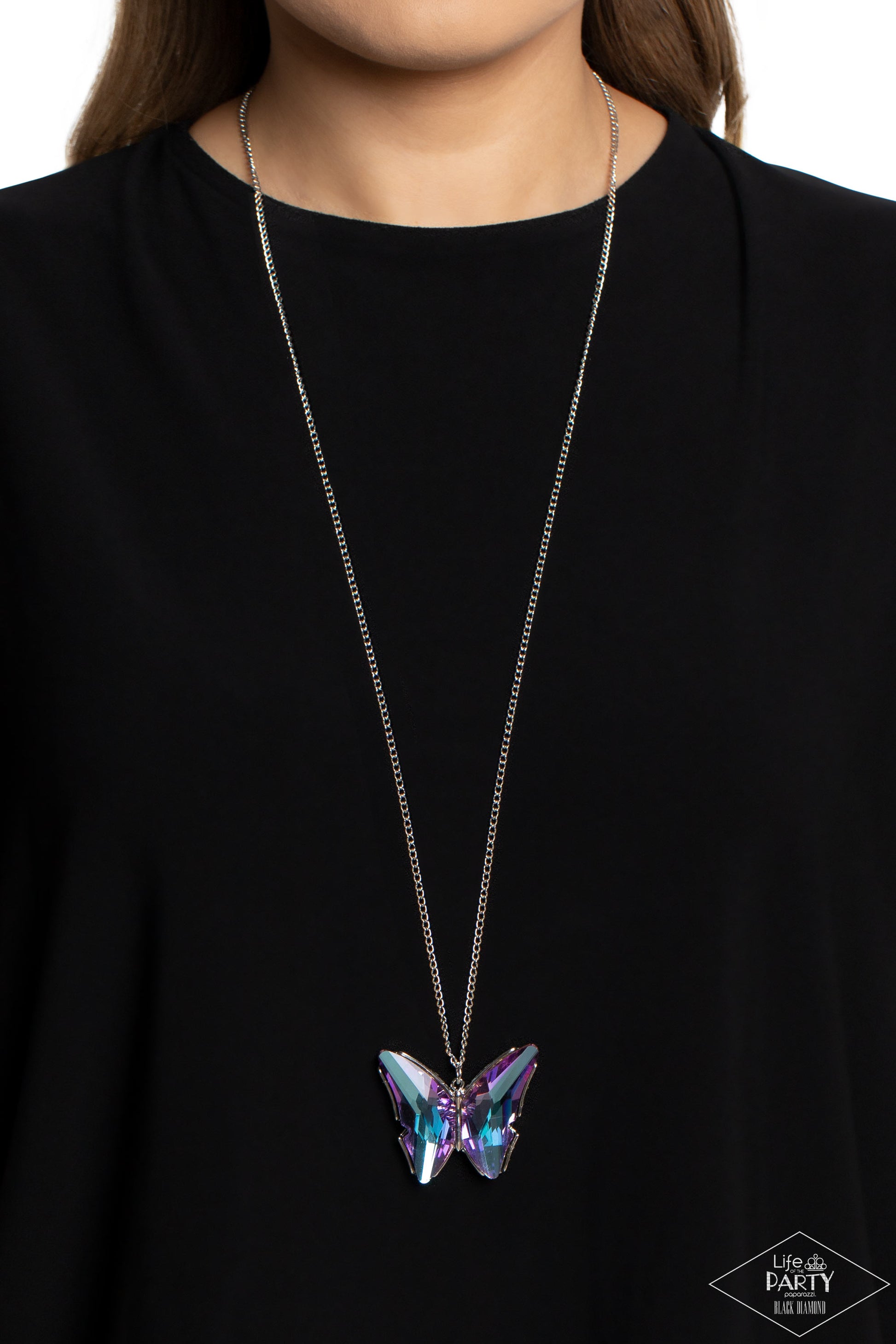 Paparazzi Accessories The Social Butterfly Effect - Purple Featuring a UV effect, dramatically faceted purple and blue gems adorn the wings of a silver butterfly, creating an ethereal pendant at the bottom of a lengthened silver chain. Features an adjusta