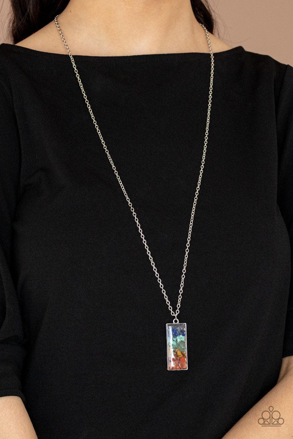 Paparazzi Accessories Retro Rock Collection - Multi Rows of multicolored pebbles are encased inside of a glassy rectangular frame, creating an iridescent pendant at the bottom of a lengthened silver chain. Features an adjustable clasp closure. Sold as one