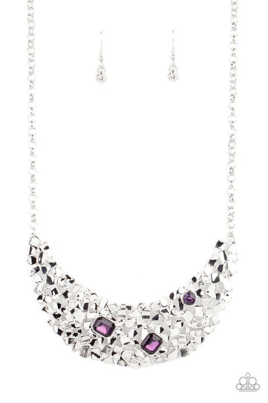 Paparazzi Accessories Fabulously Fragmented - Purple Sporadically dotted in mismatched purple and white rhinestones, a smattering of fragmented silver frames coalesce into a bold half moon below the collar for an edgy fashion. Features an adjustable clasp