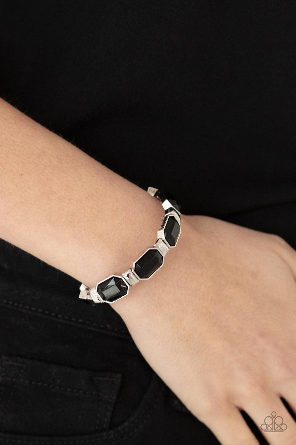 Paparazzi Accessories Fashion Fable - Black Encased in sleek silver fittings, faceted black beads join dainty silver rectangular frames along stretchy bands around the wrist for a dainty pop of color. Sold as one individual bracelet. Bracelets