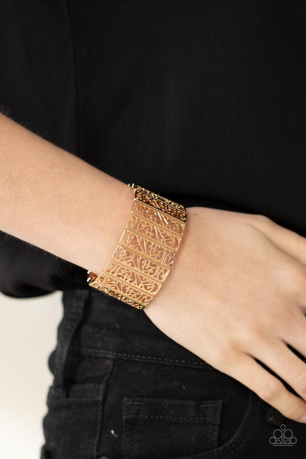 Paparazzi Accessories Ornate Orchards - Gold Filled with vine-like filigree centers, dainty gold rectangular frames are threaded along stretchy bands around the wrist for a seasonal inspired fashion. Sold as one individual bracelet. Jewelry