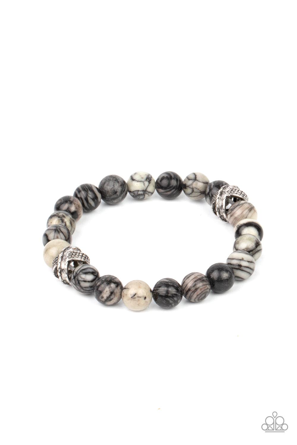 Paparazzi Accessories ZEN Commandments - Black Infused with textured silver accents, an earthy collection of swirling black and white stones are threaded along a stretchy band around the wrist for a seasonal fashion. Sold as one individual bracelet. Brace