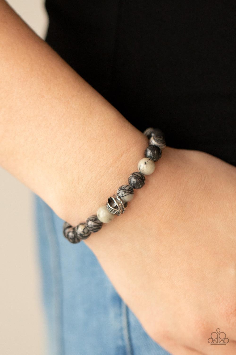 Paparazzi Accessories ZEN Commandments - Black Infused with textured silver accents, an earthy collection of swirling black and white stones are threaded along a stretchy band around the wrist for a seasonal fashion. Sold as one individual bracelet. Brace