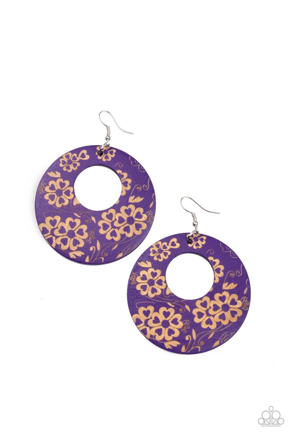 Paparazzi Accessories Galapagos Garden Party - Purple The front of a purple wooden frame is delicately etched in a flowery tropical pattern, creating a colorful hoop. Earring attaches to a standard fishhook fitting. Sold as one pair of earrings. Jewelry