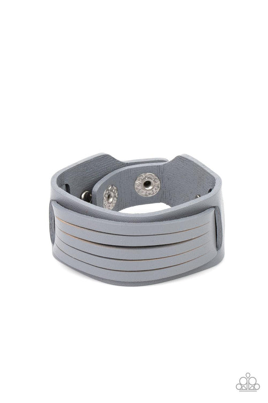 Paparazzi Accessories Ride In Style - Silver Spliced into layers, a gray leather band is threaded through the center of a larger gray leather band and studded in place for a rustic finish. Features an adjustable snap closure. Sold as one individual bracel