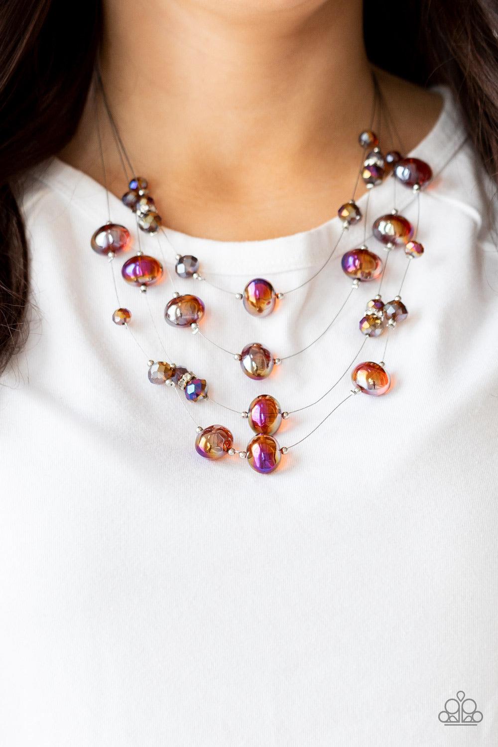 Paparazzi Accessories Cosmic Real Estate - Brown Featuring an oil spill finish, glassy brown beads and faceted crystal-like accents are fitted in place along dainty wires, creating the illusion of floating layers below the collar. Dainty silver beads and