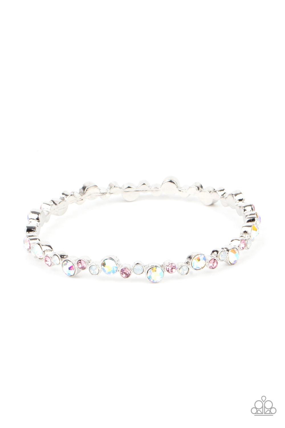 Paparazzi Accessories Twinkly Trendsetter - Multi Encased in sleek silver fittings, a twinkly collection of dark pink, iridescent, and white rhinestones coalesce into a glittery bangle around the wrist. Sold as one individual bracelet. Jewelry