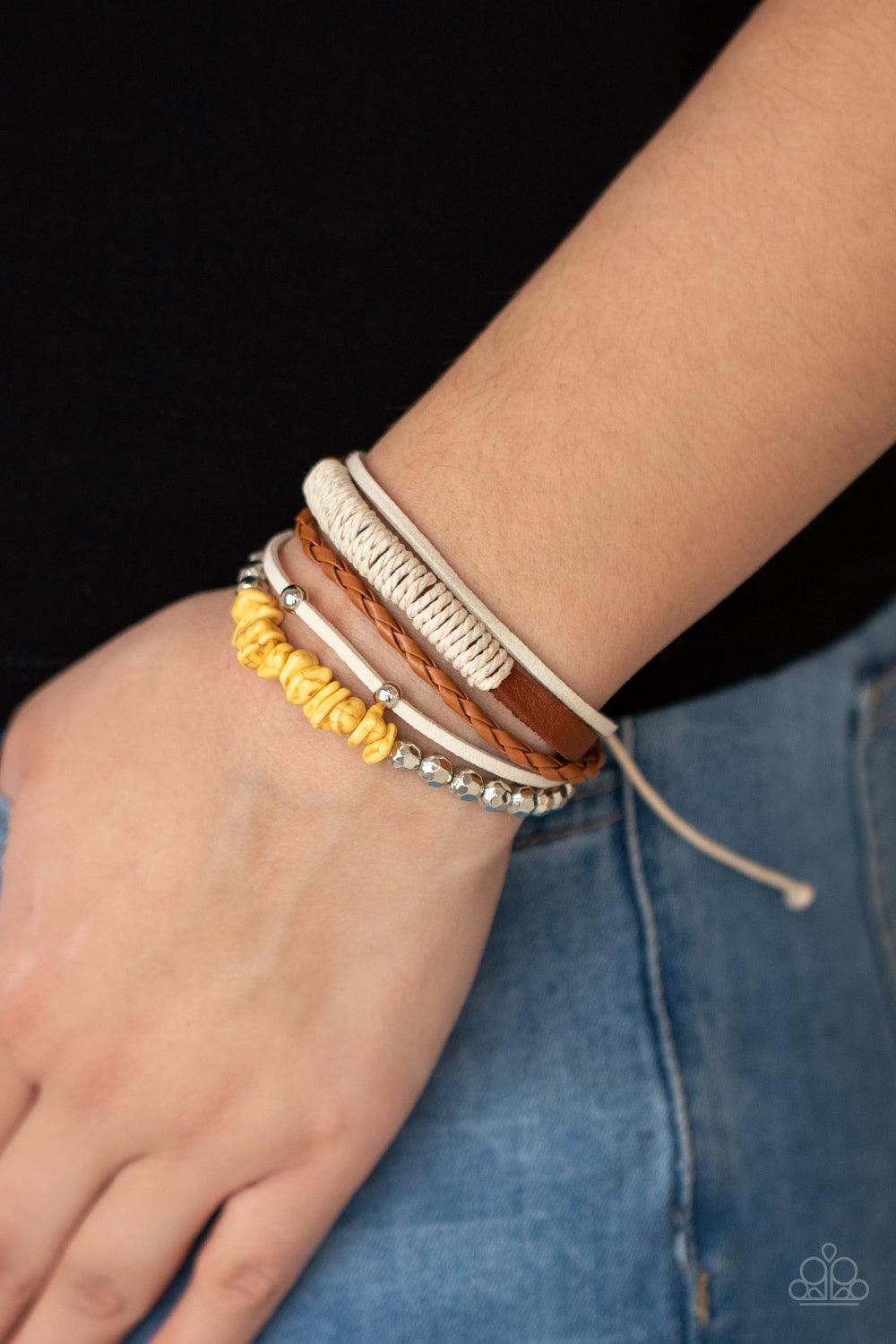 Paparazzi Accessories Keep At ROAM Temperature - Yellow A strand of yellow pebbles and faceted silver beads joins rustic suede and leather bands around the wrist, creating earthy layers. Features an adjustable sliding knot closure. Sold as one individual