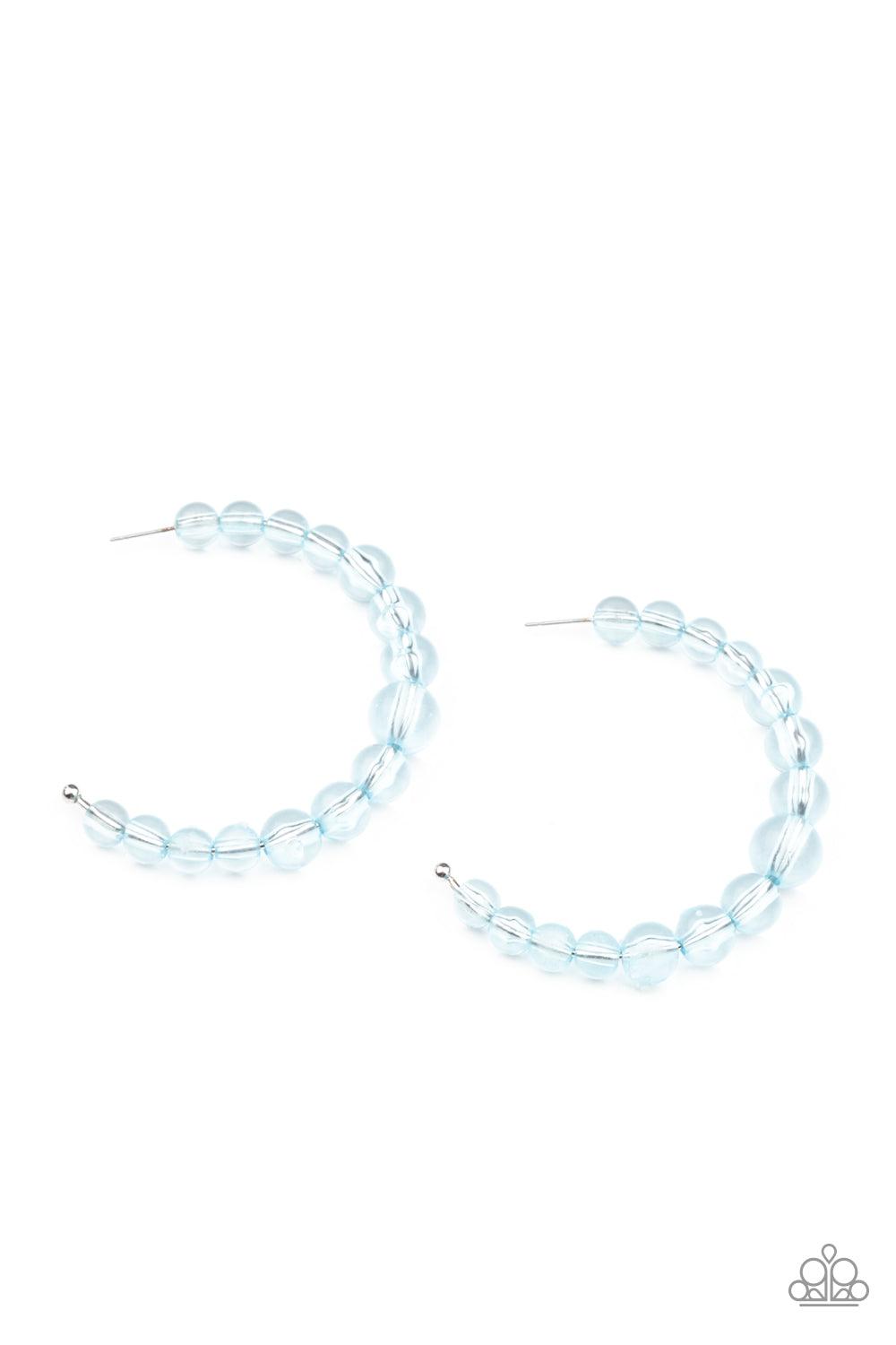 Paparazzi Accessories In The Clear - Blue Gradually increasing in size at the center, a glassy collection of Cerulean beads are threaded along an oversized hoop for a bubbly effect. Earring attaches to a standard post fitting. Hoop measures approximately