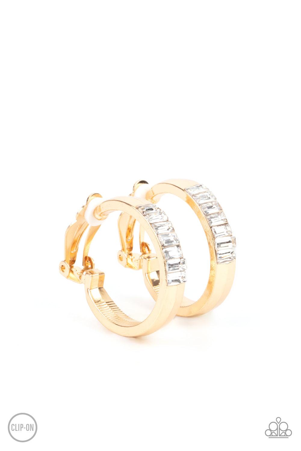 Paparazzi Accessories Ready, Steady, GLOW - Gold **Clip-On** Featuring emerald style cuts, a row of glassy white rhinestones adorn the top front of a thick gold hoop for a classic finish. Earring attaches to a standard clip-on fitting. Sold as one pair of