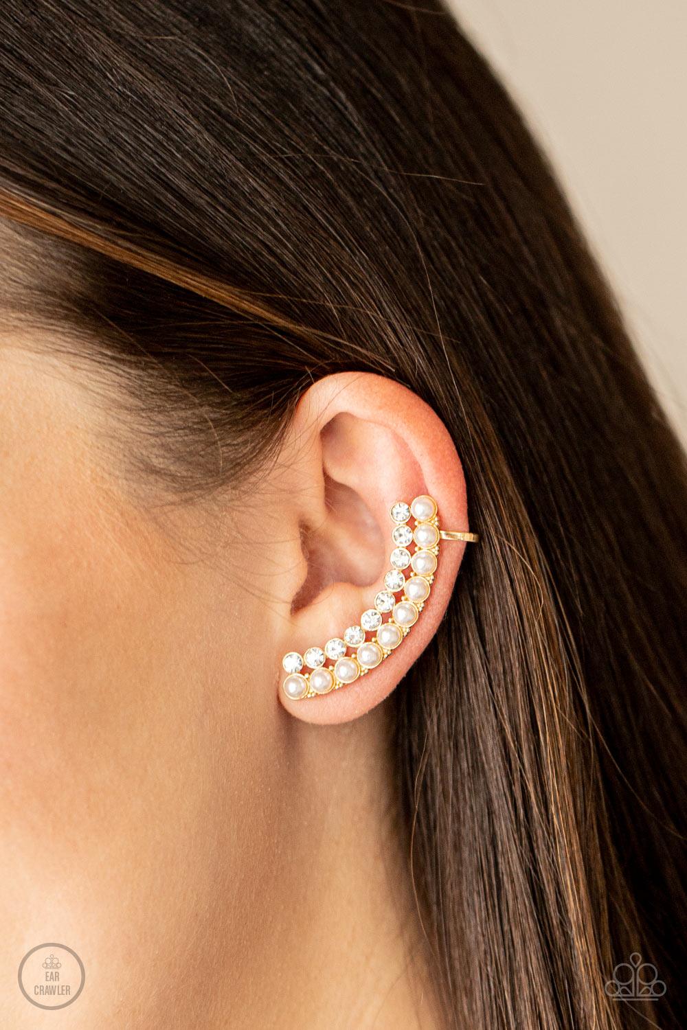 Paparazzi Accessories Doubled Down On Dazzle - Gold Featuring classic gold fittings, two rows of dainty white pearls and glassy white rhinestones arch into a timeless statement piece. Earring attaches to a standard post earring. Features a clip-on fitting