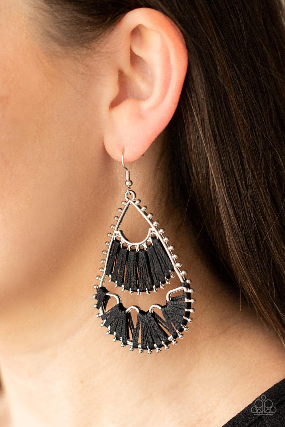 Paparazzi Accessories Samba Scene - Black Three abstract silver fittings section off the inside of a pronged teardrop. Black thread is wrapped around the bar-like fittings, creating colorful loom-like accents. Earring attaches to a standard fishhook fitti