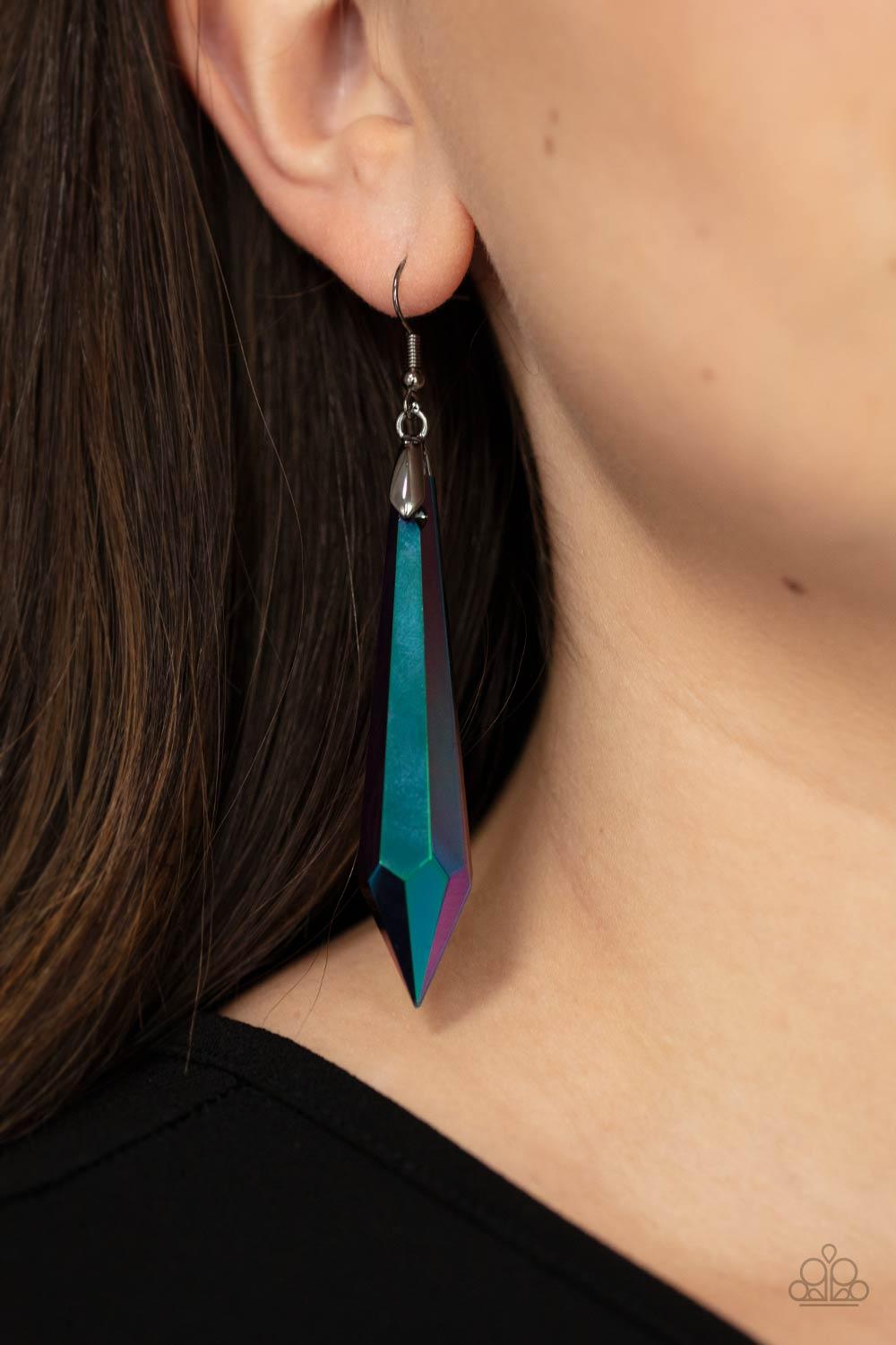 Paparazzi Accessories Sharp Dressed DIVA - Multi Featuring a stellar oil spill finish, a dramatically elongated gem attaches to a gunmetal fitting that swings from the ear for a hypnotizing fashion. Earring attaches to a standard fishhook fitting. Sold as