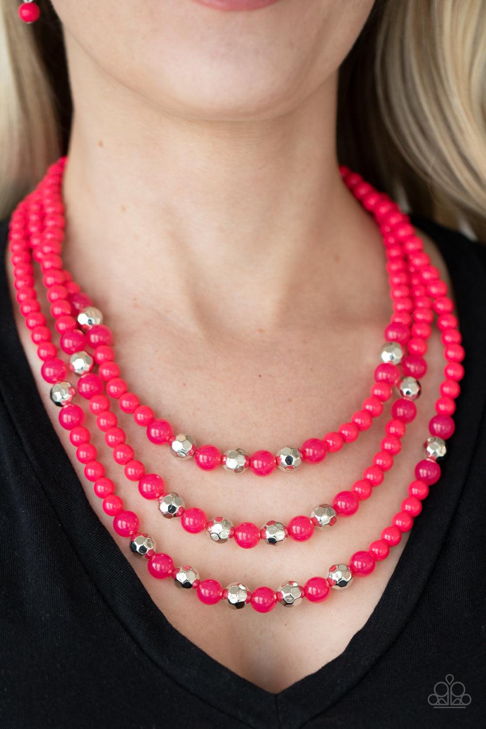 Paparazzi Accessories STAYCATION All I Ever Wanted - Pink A colorful collection of polished pink beads, faceted silver beads, and opaque pink beads are threaded along invisible wires across the chest, creating vivacious layers. Features an adjustable clas