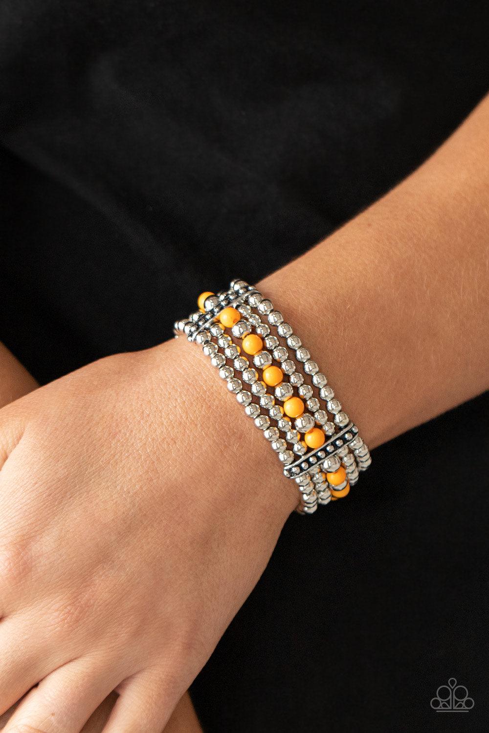 Paparazzi Accessories Gloss Over The Details - Orange Held together by studded silver frames, rows of silver and Marigold beads are threaded along stretchy bands around the wrist, creating vivacious layers. Sold as one individual bracelet. Jewelry