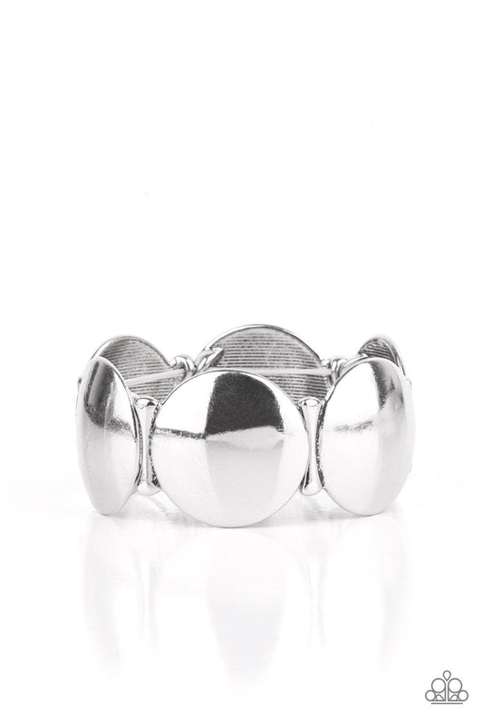 Paparazzi Accessories Going, Going, GONG! - Silver Infused with curved bar-like accents, a shiny series of beveled silver discs are threaded along stretchy bands around the wrist for a bubbly metallic look. Sold as one individual bracelet. Jewelry