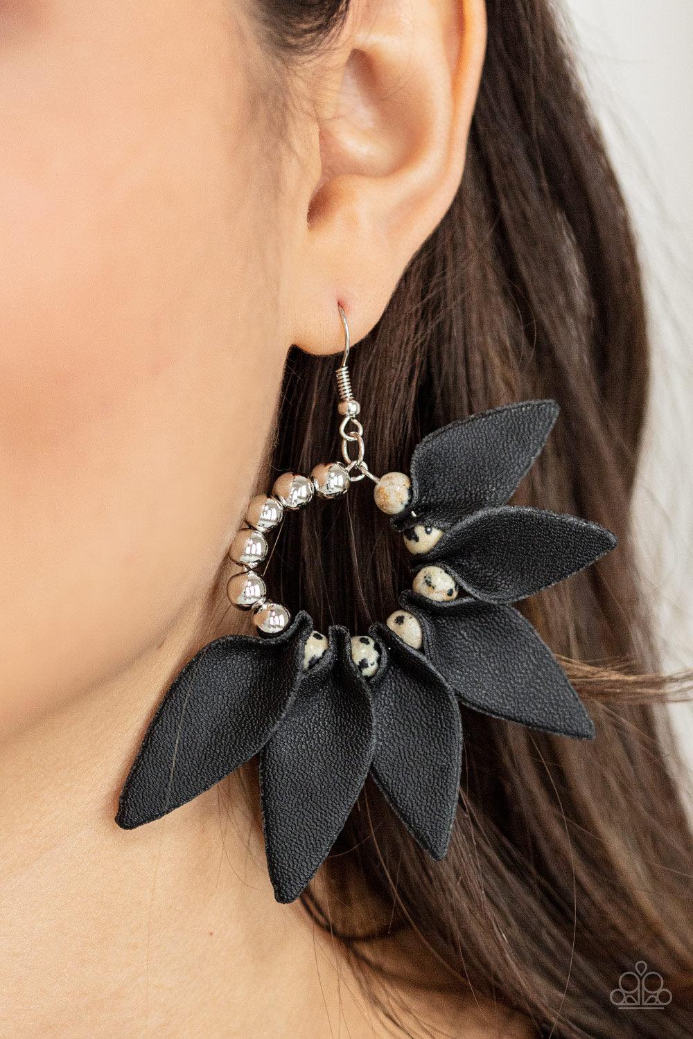 Paparazzi Accessories Flower Child Fever - Black Infused with a row of shiny silver beads, black leather petals are separated by black dotted white stones along a dainty silver hoop, creating a wild fringe. Earring attaches to a standard fishhook fitting.