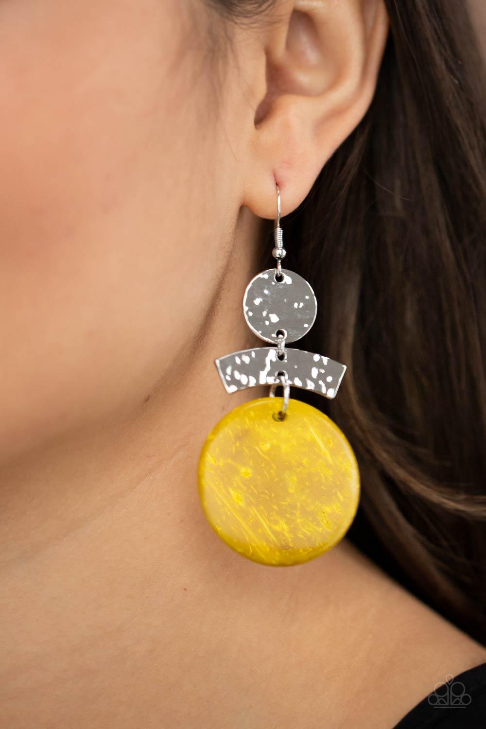 Paparazzi Accessories Diva Of My Domain - Yellow Featuring a distressed yellow finish, a wooden disc swings from the bottom of a hammered curved plate and hammered silver disc, coalescing into an earthy lure. Earring attaches to a standard fishhook fittin