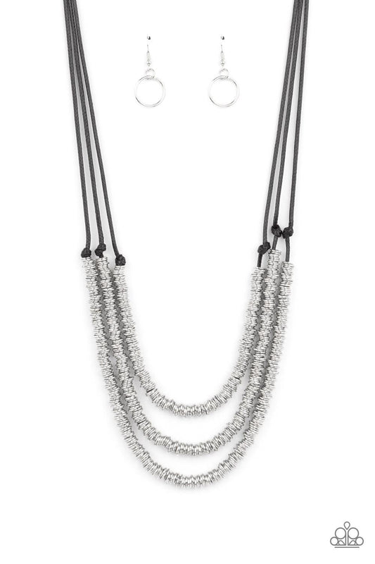 Paparazzi Accessories RING to Reason - Black A seemingly infinite collection of dainty silver rings are knotted in place along three black cords, creating edgy layers across the chest. Features an adjustable clasp closure. Sold as one individual necklace.
