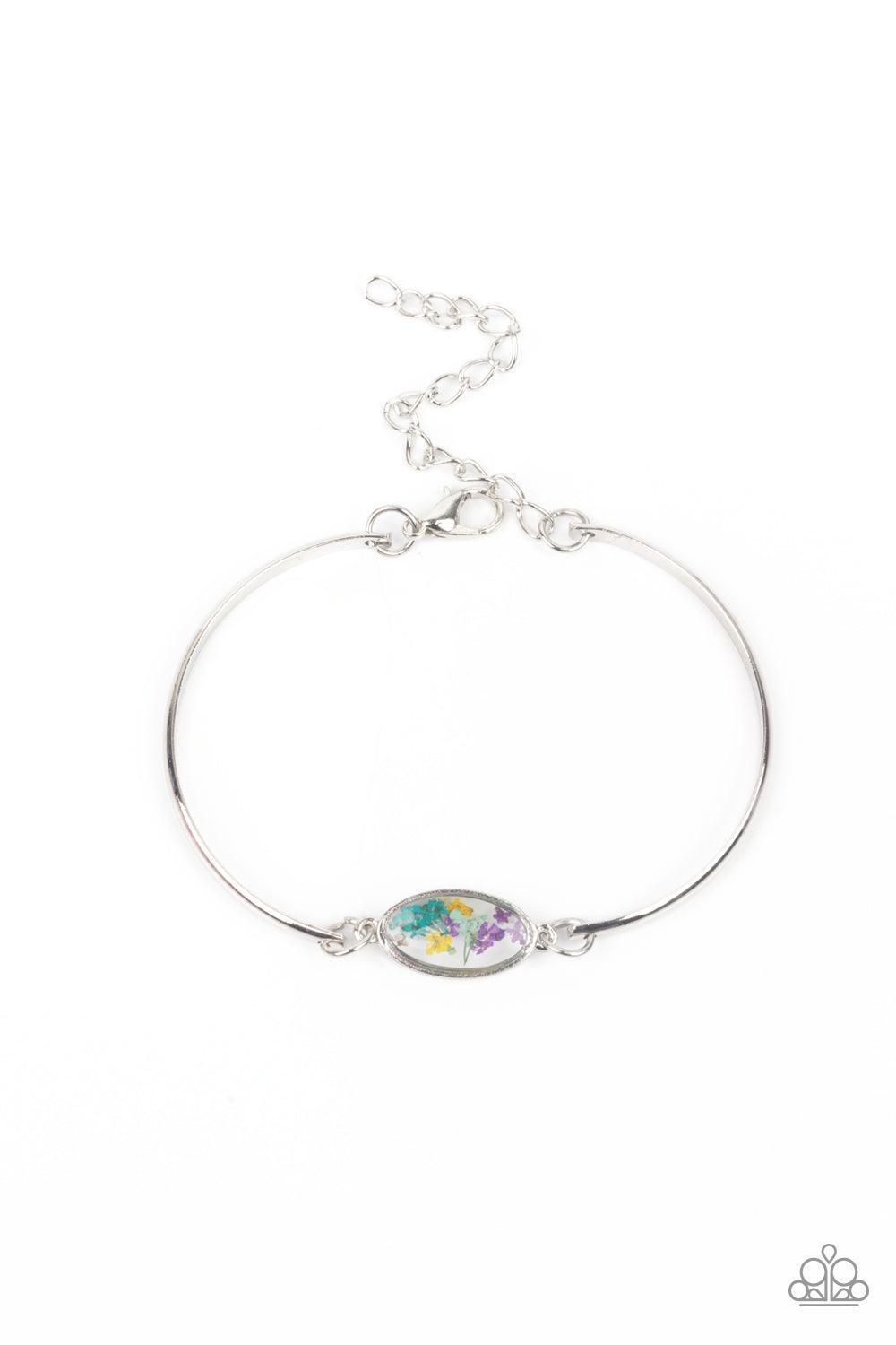 Paparazzi Accessories Farmhouse Fairytale - Multi A collection of colorful wildflowers is encased in a glassy casing bordered in silver that attaches to two shiny silver bars around the wrist, creating a whimsically dainty centerpiece. Features an adjusta