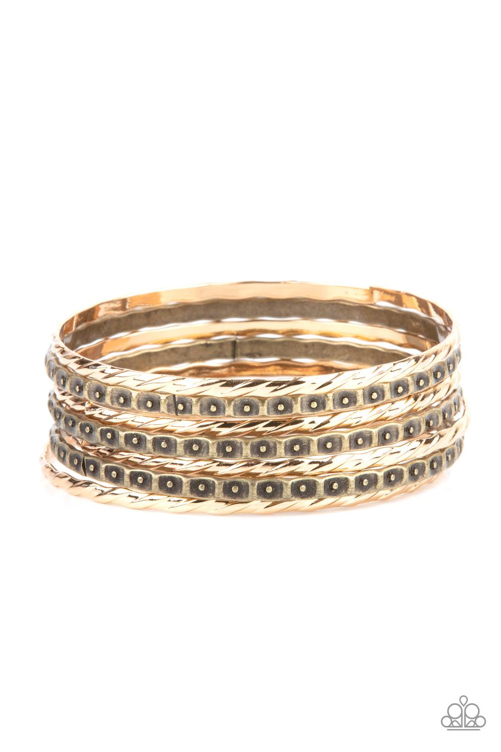 Paparazzi Accessories Back-To-Back Stacks - Multi Embossed in slanted ribbons of textured and studded hammered patterns, trios of mismatched brass and gold bangles stack across the wrist for an intense industrial vibe. Sold as one set of six bracelets. Je