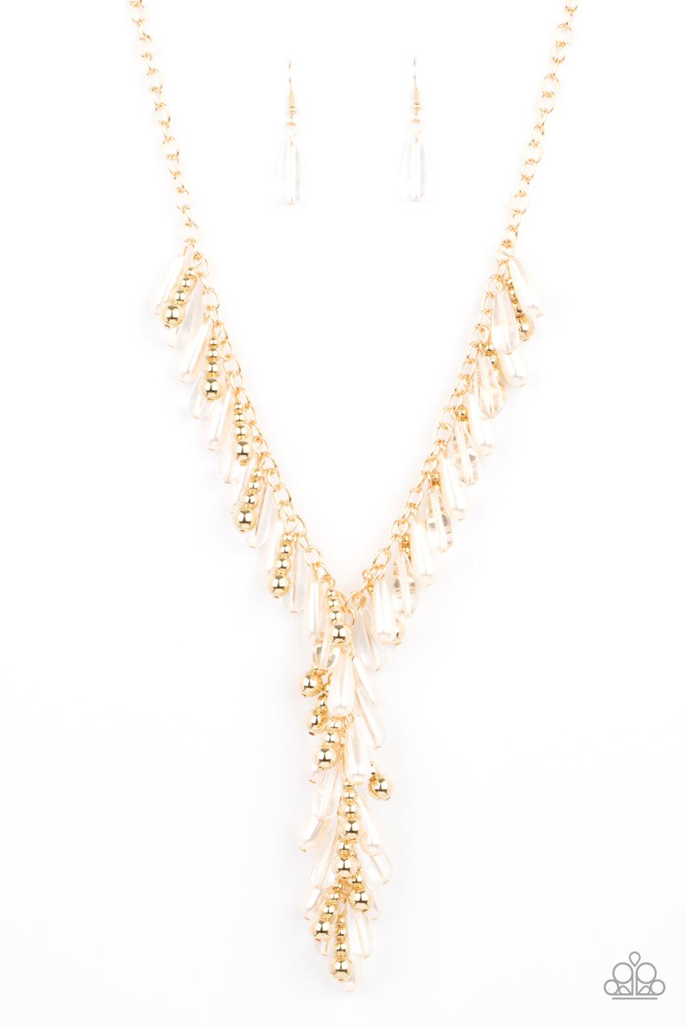 Paparazzi Accessories Dripping With DIVA-ttitude - Gold Glassy, pearly, and gold beaded teardrops elegantly drip along a classic gold chain across the chest. Matching beads cascade from an extended tassel, creating a glamorously clustered pendant. Feature