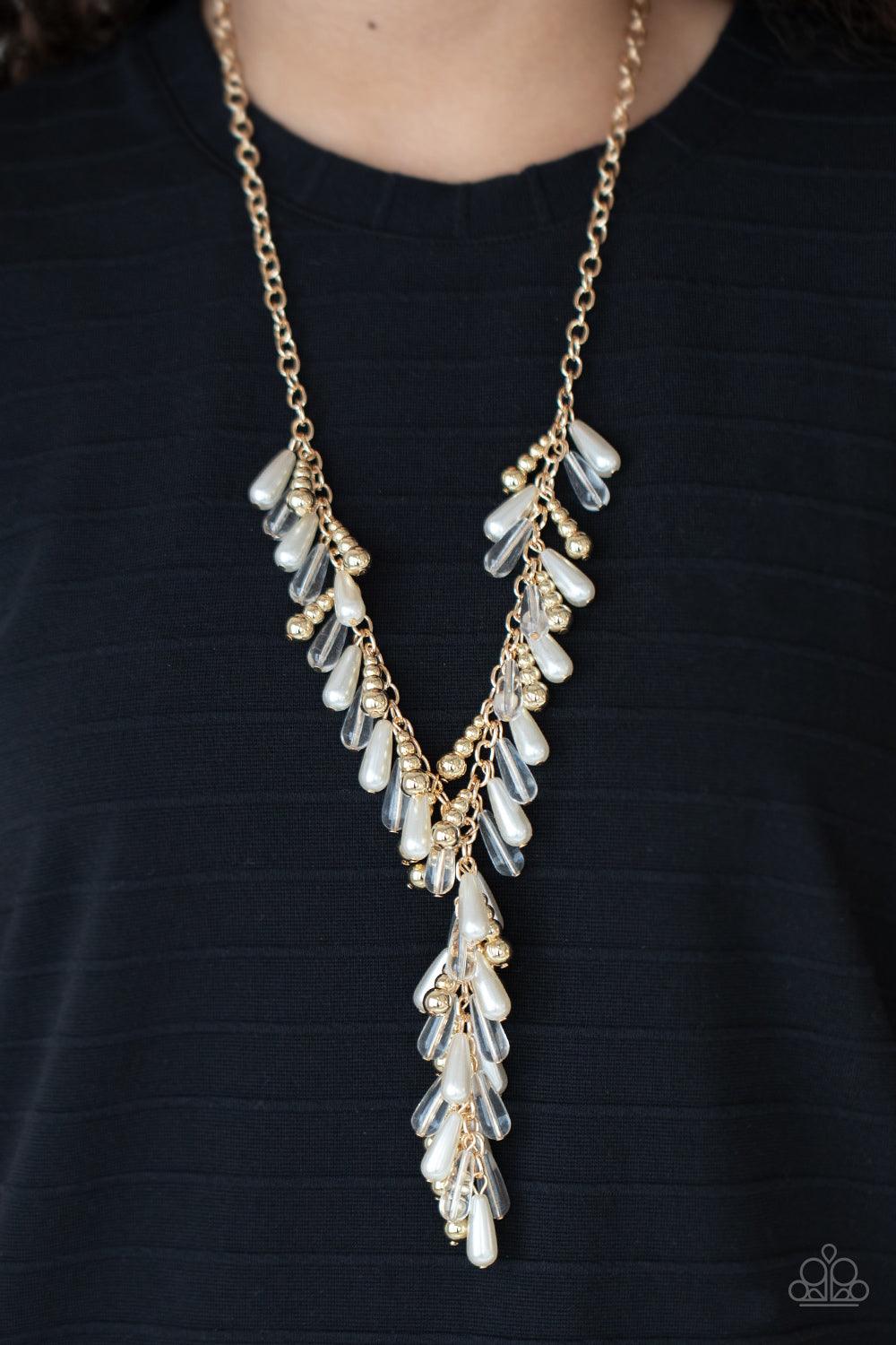 Paparazzi Accessories Dripping With DIVA-ttitude - Gold Glassy, pearly, and gold beaded teardrops elegantly drip along a classic gold chain across the chest. Matching beads cascade from an extended tassel, creating a glamorously clustered pendant. Feature
