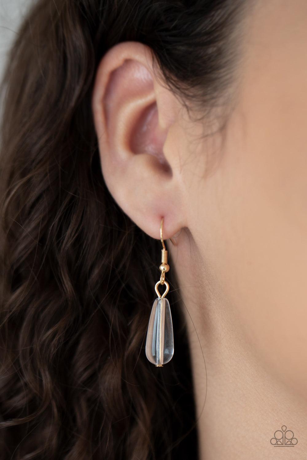 Paparazzi Accessories Dripping With DIVA-ttitude - Gold Glassy, pearly, and gold beaded teardrops elegantly drip along a classic gold chain across the chest. Matching beads cascade from an extended tassel, creating a glamorously clustered pendant. Feature