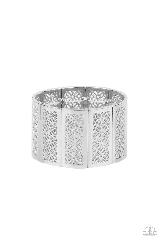 Paparazzi Accessories Thai Terrariums - Silver Filled with airy stenciled floral patterns, rectangular silver frames are threaded along stretchy bands around the wrist, creating a whimsical centerpiece. Sold as one individual bracelet. Jewelry