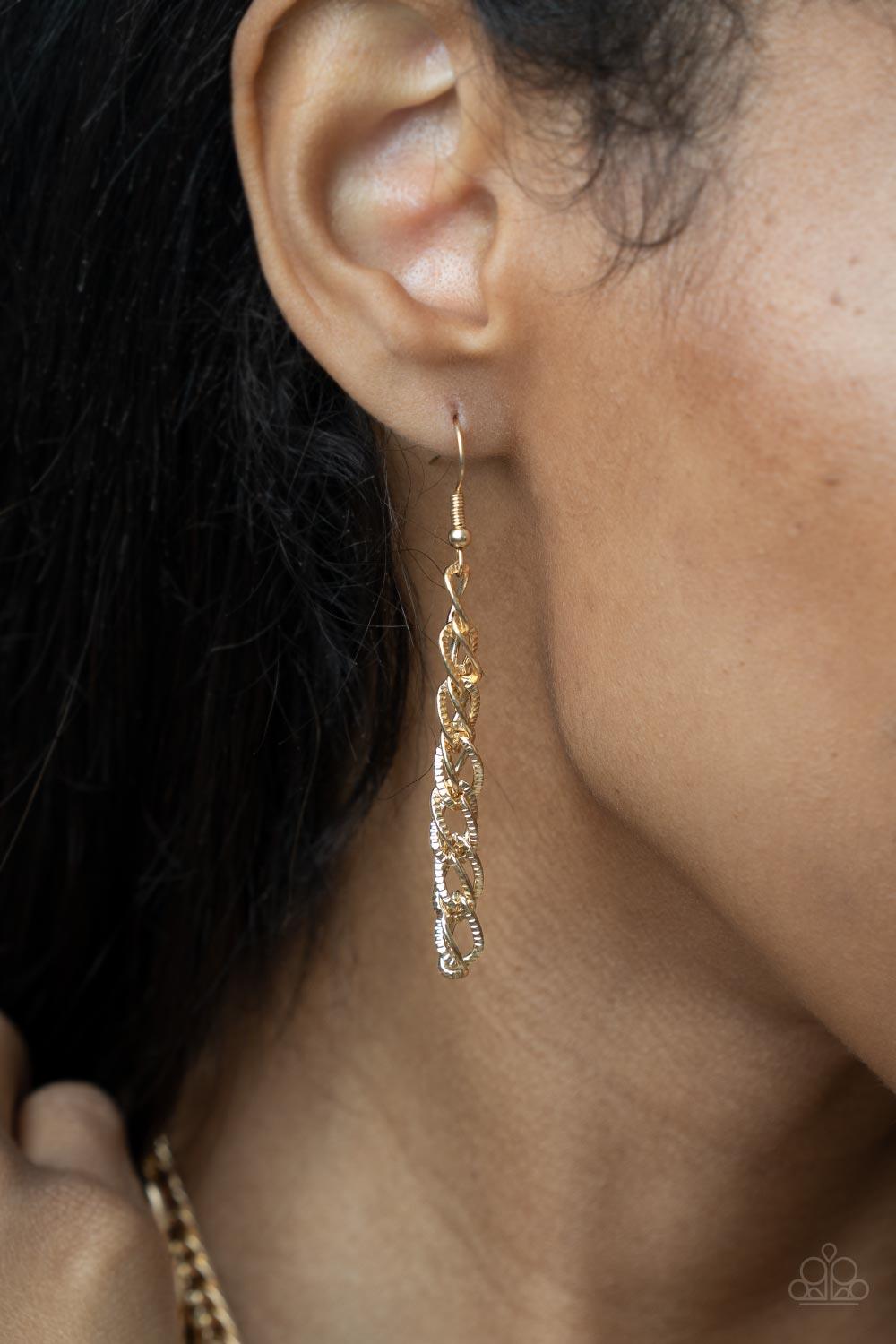 Paparazzi Accessories Chain of Champions - Gold Bold layers of glistening gold chain of varying sizes and textures, fall like a weighty medal across the chest creating a shimmering industrial effect. Features an adjustable clasp closure. Sold as one indiv