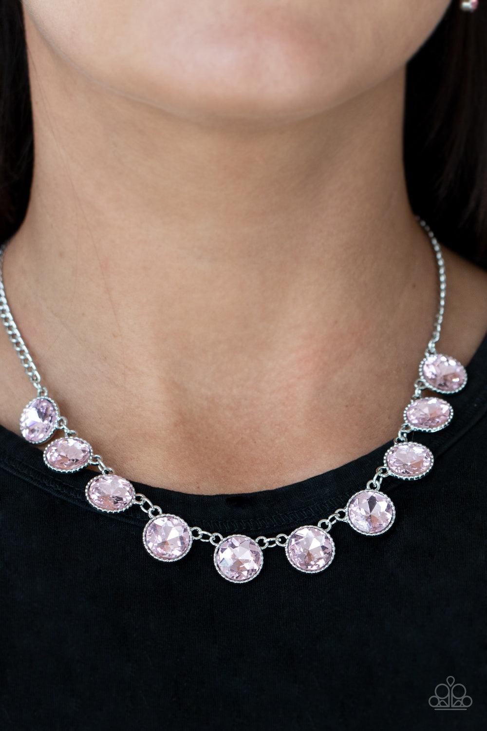 Paparazzi Accessories Mystical Majesty - Pink Featuring a mystical iridescence, a sparkling display of round cut pink gems are encased in delicately textured silver frames as they link below the collar, creating a majestic statement piece. Features an adj