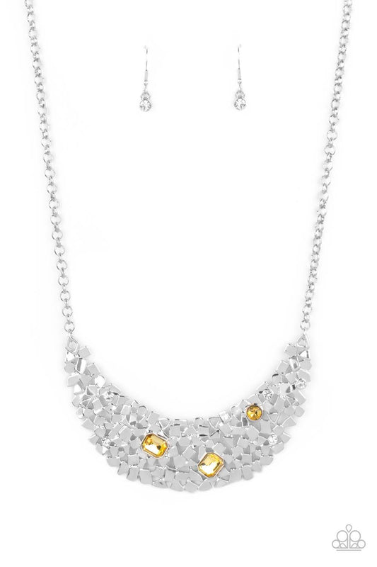 Paparazzi Accessories Fabulously Fragmented - Yellow Sporadically dotted in mismatched yellow and white rhinestones, a smattering of fragmented silver frames coalesce into a bold half moon below the collar for an edgy fashion. Features an adjustable clasp