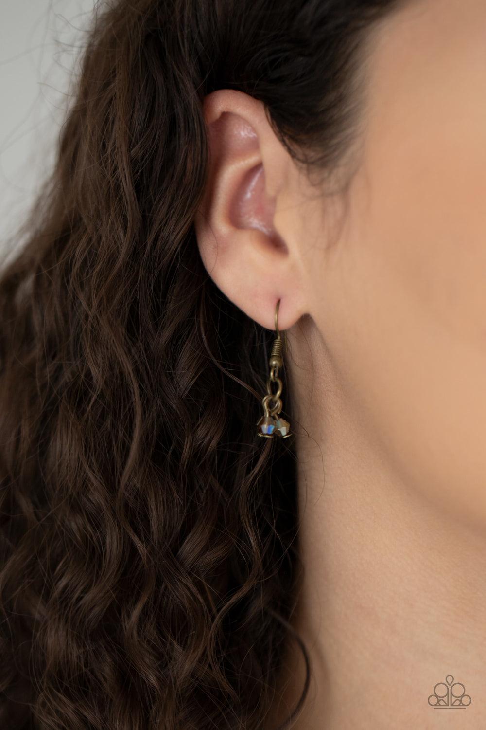 Paparazzi Accessories Let There Be TWILIGHT - Brass Dainty brassy tone-on-tone iridescent beads swing from doubled brass chains, creating a clustered fringe below the collar. Features an adjustable clasp closure. Sold as one individual necklace. Includes