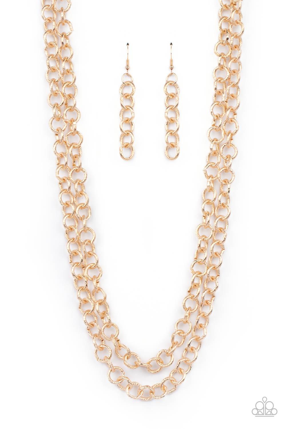 Paparazzi Accessories Grunge Goals - Gold A seemingly infinite collection of textured shiny gold links connect into two dramatic rows across the chest, creating an intense industrial display. Features an adjustable clasp closure. Sold as one individual ne